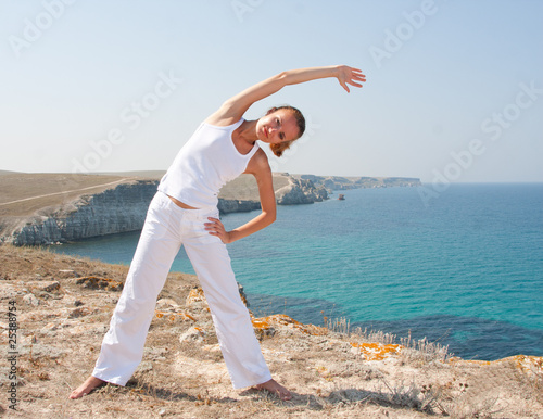 Photo: Woman practices Yoga Woman practices Yoga