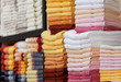 New fluffy towels on a rack in shop New fluffy towels on a rack in shop