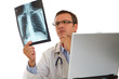 Male doctor examining an x-ray image Male doctor examining an x-ray image