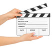 Cinema clapboard in hands