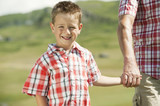 Photo: italy, seiseralm, grandfather and grandson (6-7) hand in hand, smiling, portrait, close-up italy, seiseralm, grandfather and grandson (6-7) hand in hand, smiling, portrait, close-up