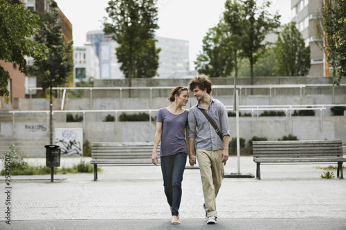 Photo: germany, berlin, young couple holding hands germany, berlin, young couple holding hands