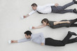 flying business people holding coffee mugs, side view