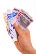 man hand whith euro bills, isolated on white