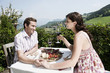 Photo: italy, south tyrol, seiseralm, couple in restaurant holding hands, smiling, portrait italy, south tyrol, seiseralm, couple in restaurant holding hands, smiling, portrait