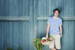 Photo: germany, bavaria, man in front of barn door holding basket with fresh vegetables, smiling, portrait germany, bavaria, man in front of barn door holding basket with fresh vegetables, smiling, portrait
