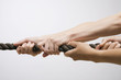 people pulling rope, close-up