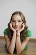germany, berlin, young woman lying on floor, portrait