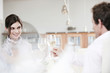 couple in restaurant toasting wine glasses