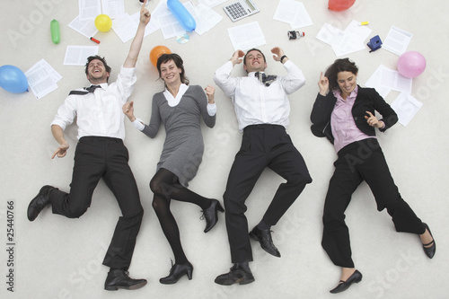Photo: office workers side by side, celebrating, portrait, elevated view office workers side by side, celebrating, portrait, elevated view