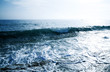foamy shore blue waves in a clear summer day foamy shore blue waves in a clear summer day