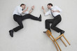 two businesssmen fighting, side view, elevated view