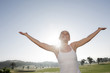 spain, mallorca, woman with arms outstretched, portrait
