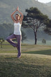spain, mallorca, woman excercising yoga, tree position
