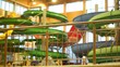 Pool with fountain is located behind metal fence in water park Pool with fountain is located behind metal fence in water park