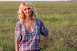 Beautiful blond young woman in a countryside