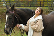 young woman with a horse