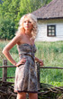 Beautiful blond young woman in the village