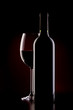 glas of red wine and bottle