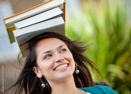 Woman balancing books