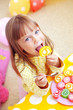 Cute child eating candies
