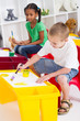happy young kids painting in classroom happy young kids painting in classroom
