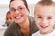 close-up  of happy teacher and young student
