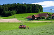 tractor standing next to the mowed grass