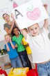 happy preschool boy with classmates