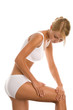 Woman massaging her leg