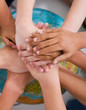 diverse kids hand on globe