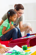 art teacher helping young student painting