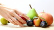 woman selects fruit
