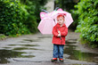 Adorable toddler girl at rainy day