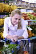 woman reading her shopping list in the supermarket