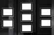 Estate agency window at night