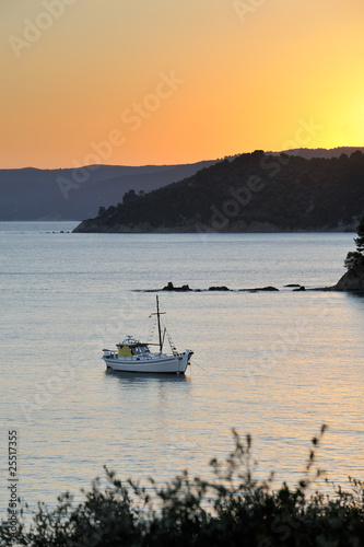 Boat in Greek archipelago during late afternoon Boat in Greek archipelago during late afternoon