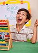 Boy with abacus screaming loudly
