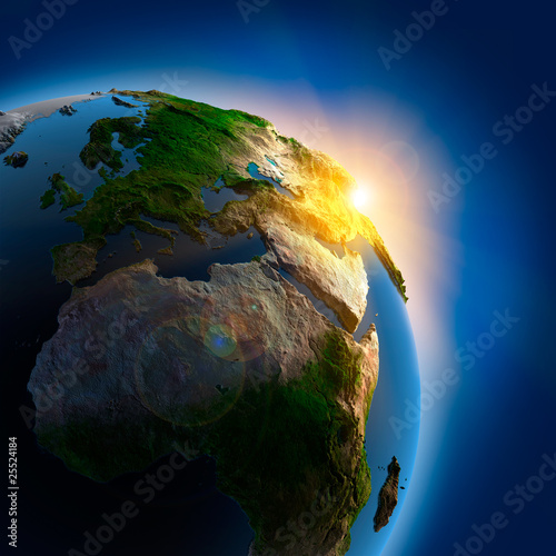 Fototapeta Sunrise over the Earth in outer space