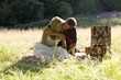 A young couple having a picnic, embracing
