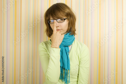Photo: Beautiful young woman in glasses. Correcting glasses Beautiful young woman in glasses. Correcting glasses