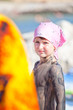 Little girl covered with mud