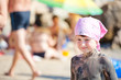 Little girl covered with mud