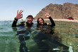 scuba divers on the surface