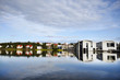 Town hall and houses by the Tjornin lake in Reykjavik