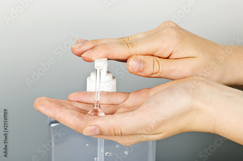 Photo: Hands applying sanitizer gel Hands applying sanitizer gel