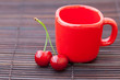 cherry cup on bamboo mat cherry cup on bamboo mat