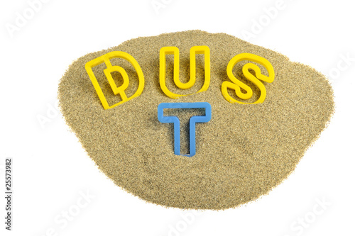 Photo: dust written on sand with colored letters dust written on sand with colored letters