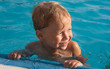 Happy boy in the swimming pool