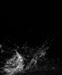 Stylish water splash. Isolated on black background
